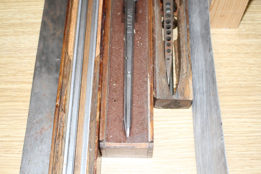 Three wooden cased technical draughtsman tools, stamped for the owner FJ Pearl, largest 77cm